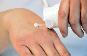 Applying Cream To Dry Hands